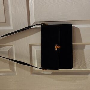 Salvatore Ferragamo black suede Gancini leather satchel.